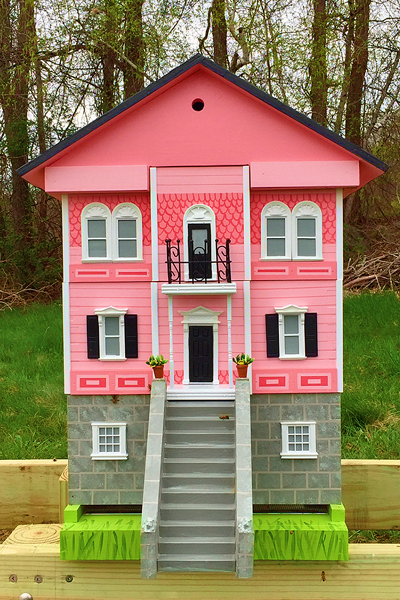A Victorian style beehive, pink and white.