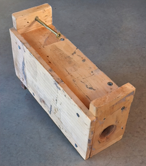 An extension is attached to the bees’ main entrance to move it away from the tree or structure. It can be made of wood or flexible tubing.