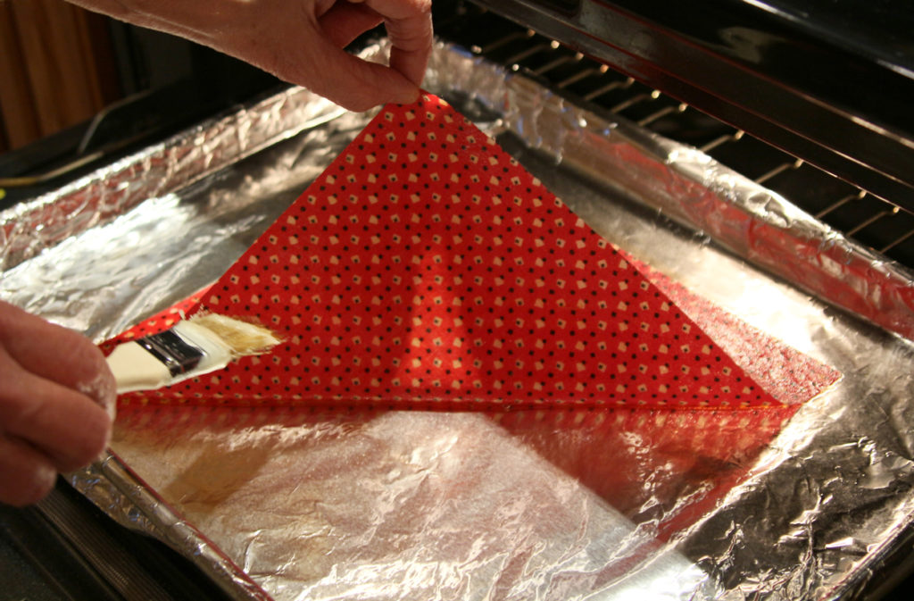 Check the back: Peek underneath the wrap to assure the wax has soaked through to the back.