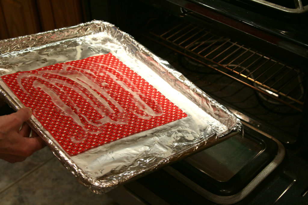 Ready for the oven: Slide the pan with the partially-hardened wax into a 200-degree oven.